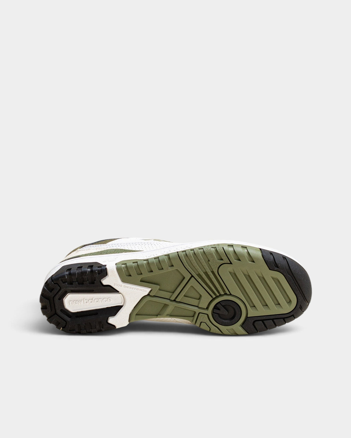 Lockwood Avenue New Balance 550 low-top sneaker showing the olive and black rubber outsole tread pattern
