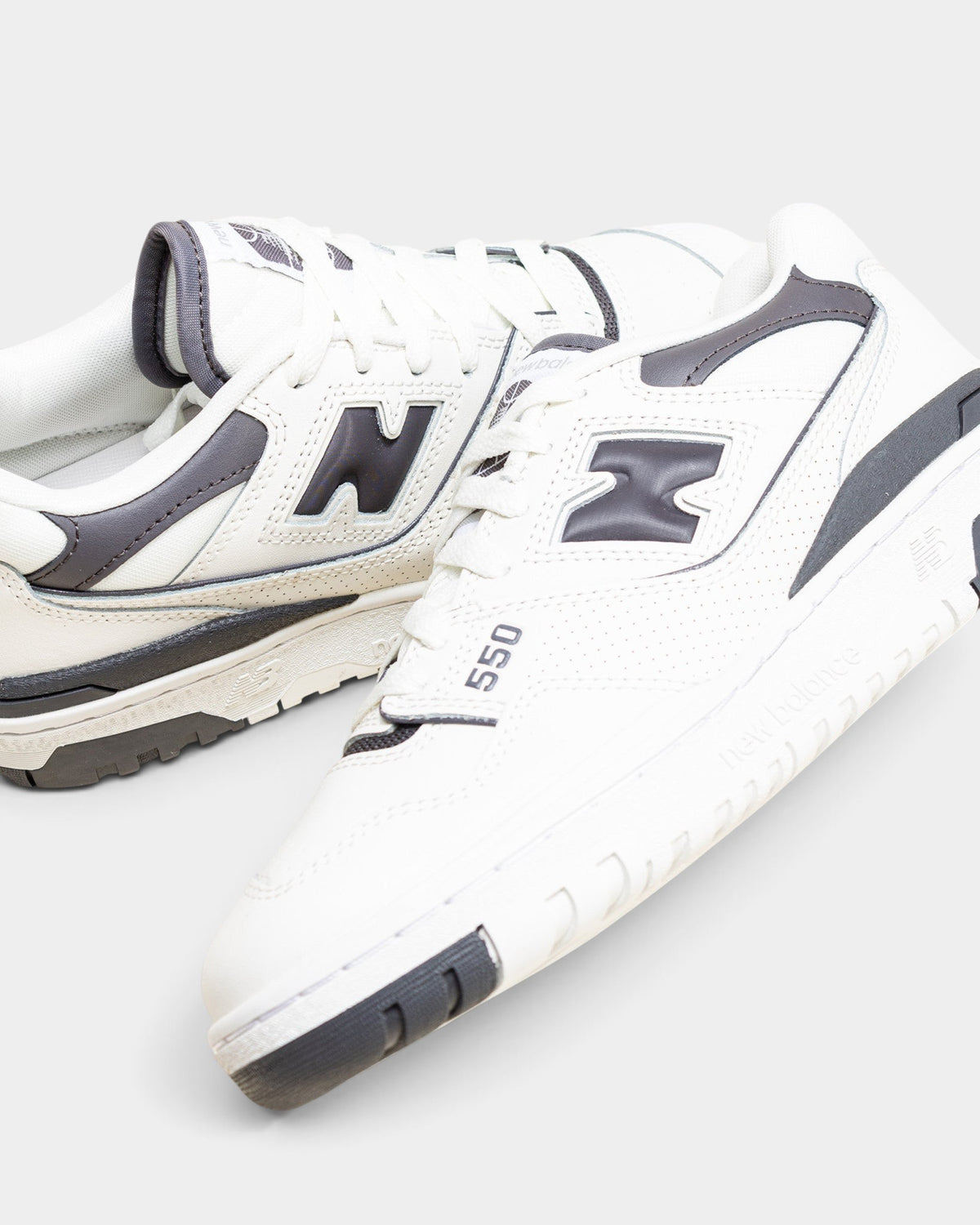 Lockwood Avenue New Balance 550 women's low-top sneakers in sea salt off-white leather with magnet gray overlays.