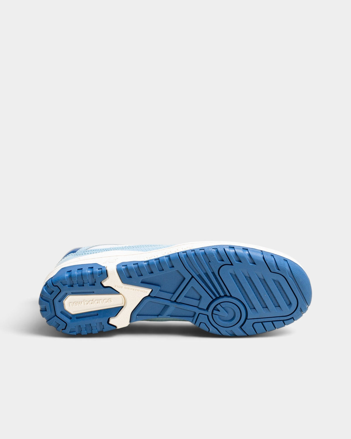 Lockwood Avenue New Balance 550 sneaker showing the blue and white rubber tread pattern on the sole