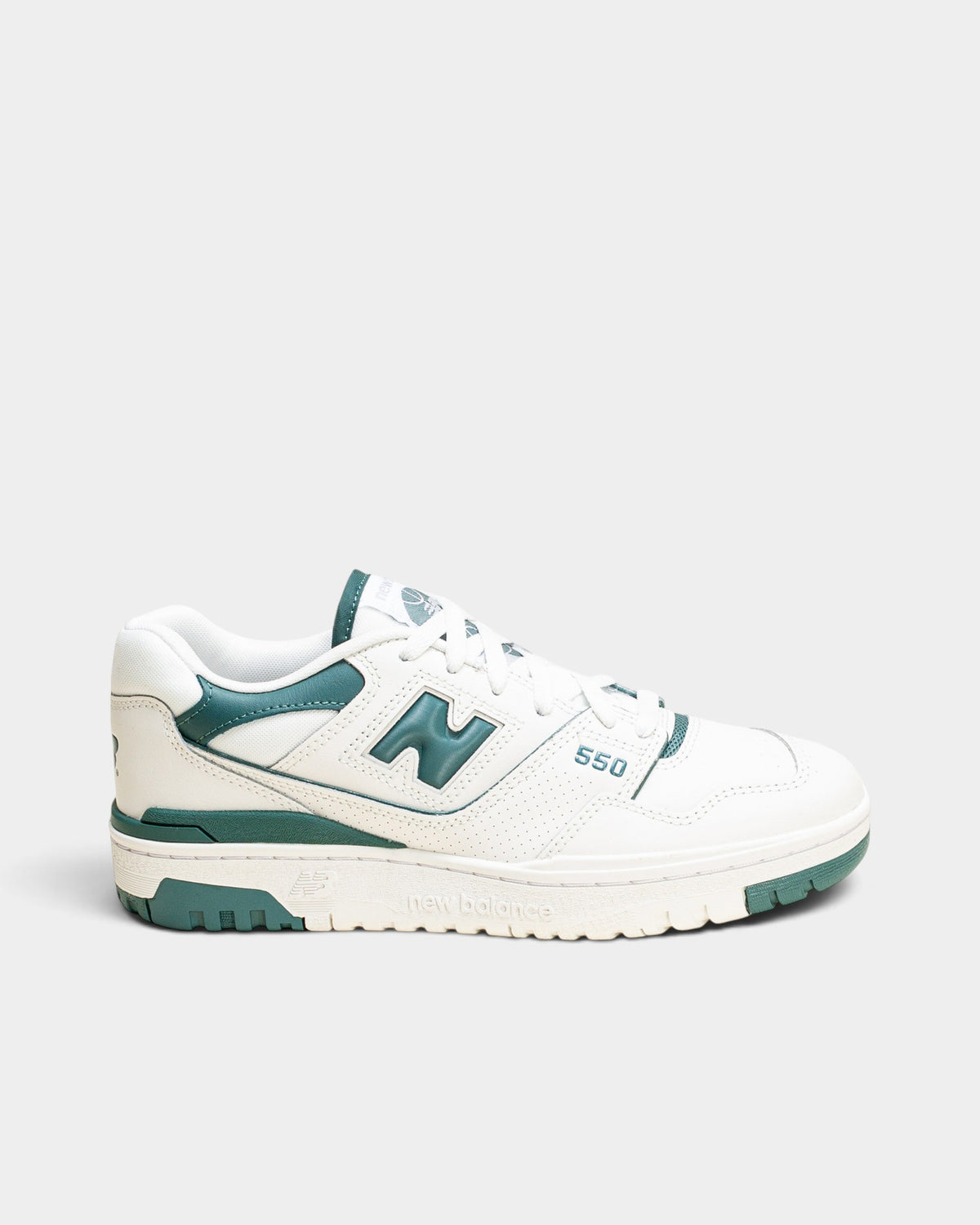Lockwood Avenue New Balance 550 women's low-top sneaker in white leather with spruce green accents and rubber cupsole
