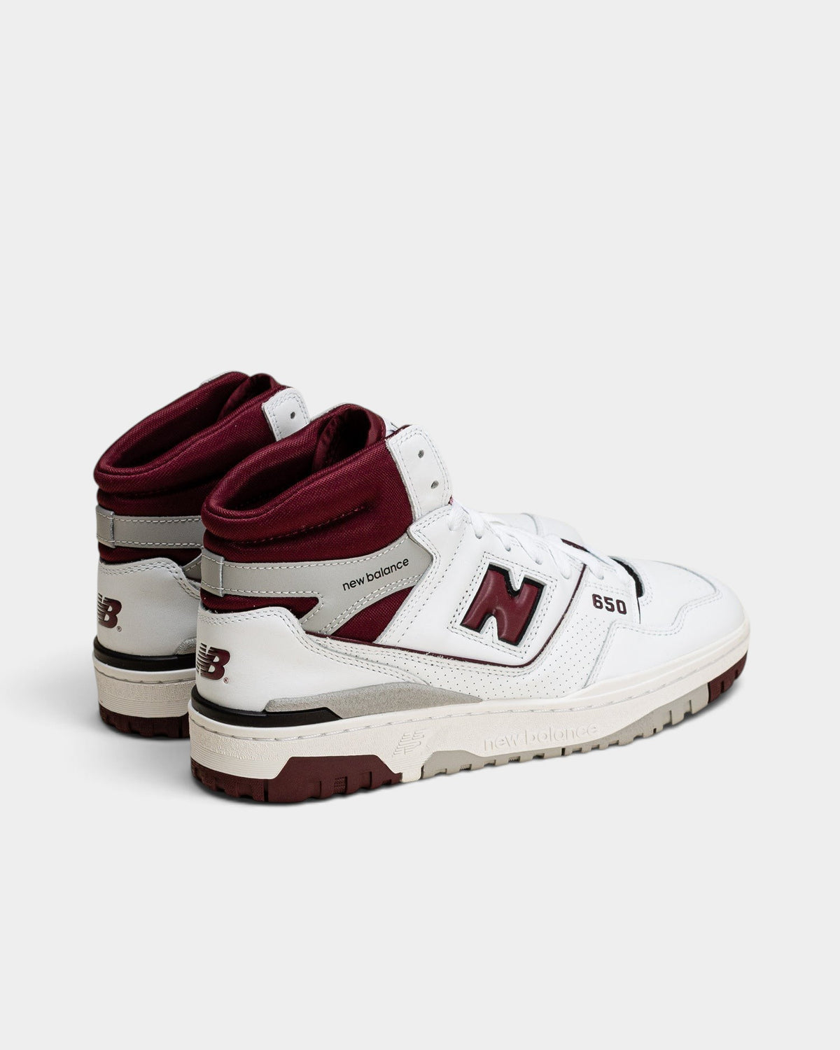 Lockwood Avenue New Balance 650 high-top sneakers in white leather with burgundy and gray accents, rear view.
