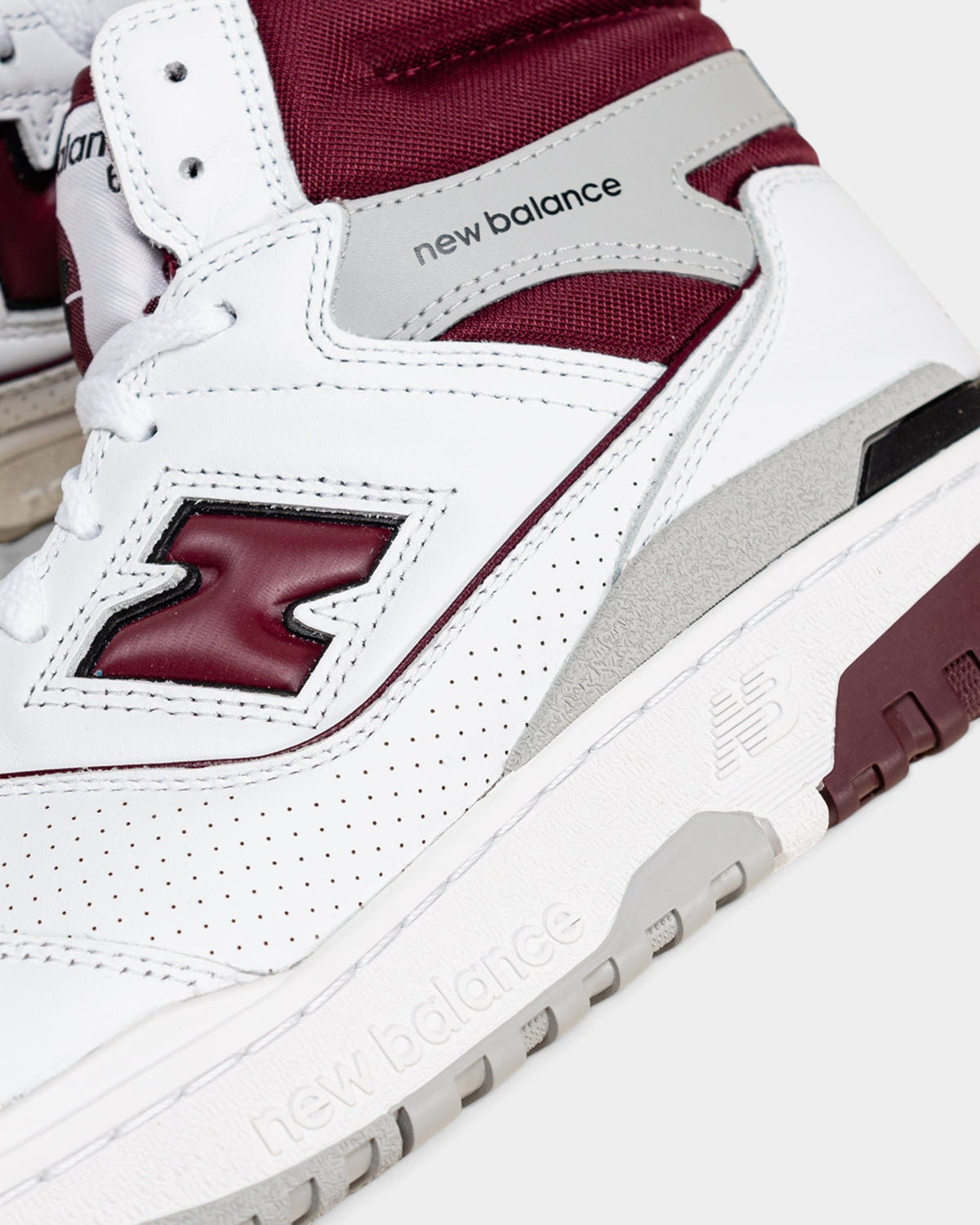 Lockwood Avenue New Balance 650 high-top sneakers in white leather with burgundy accents and gray heel detailing.