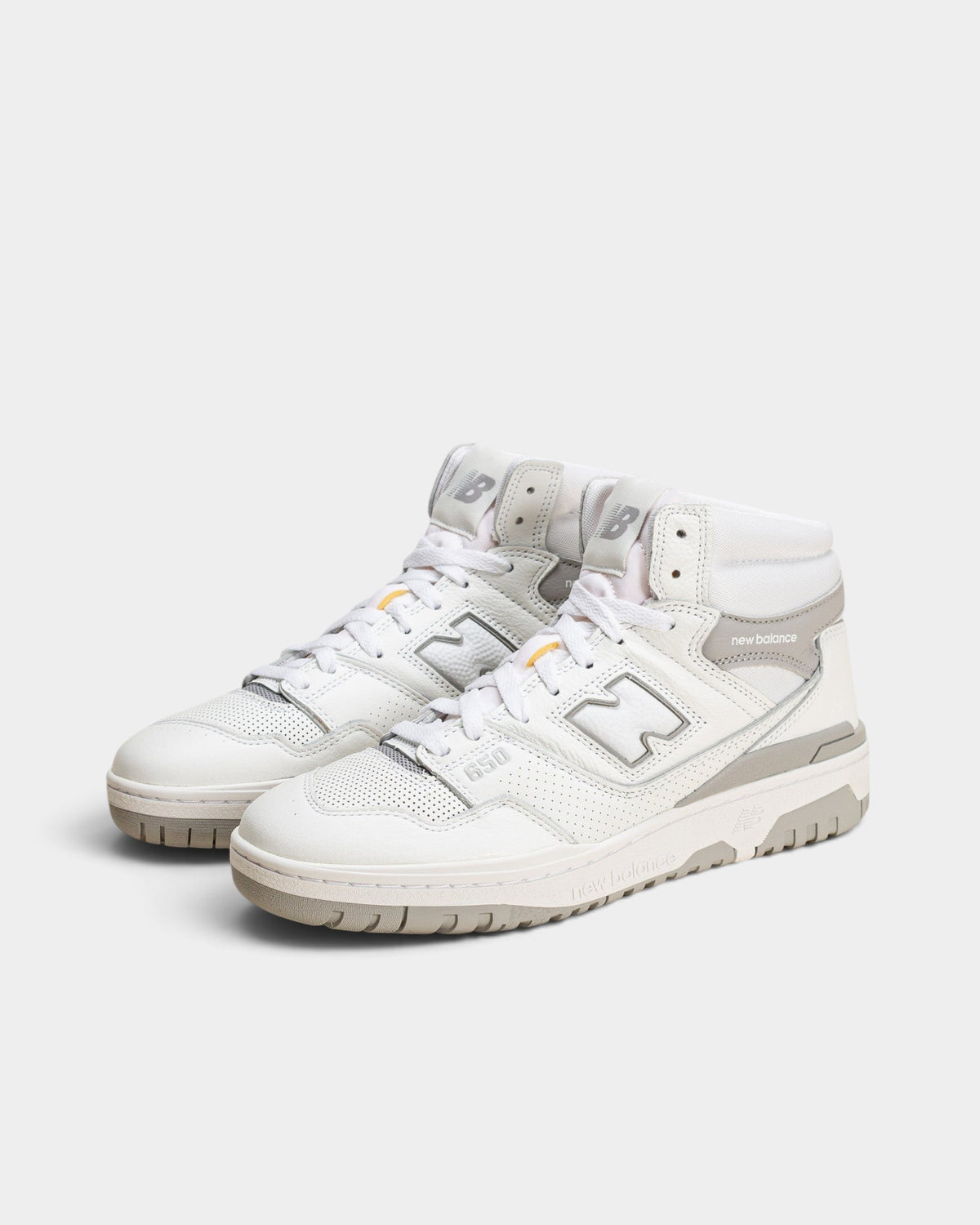 Lockwood Avenue New Balance 650R hi-top sneakers in white and raincloud gray leather with suede overlays.