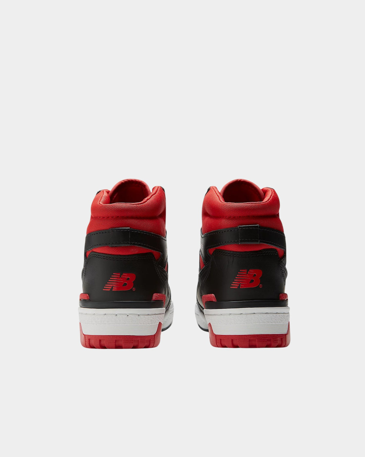 Rear view of Lockwood Avenue New Balance 650R high-top sneakers in black, red, and white leather with NB heel branding.