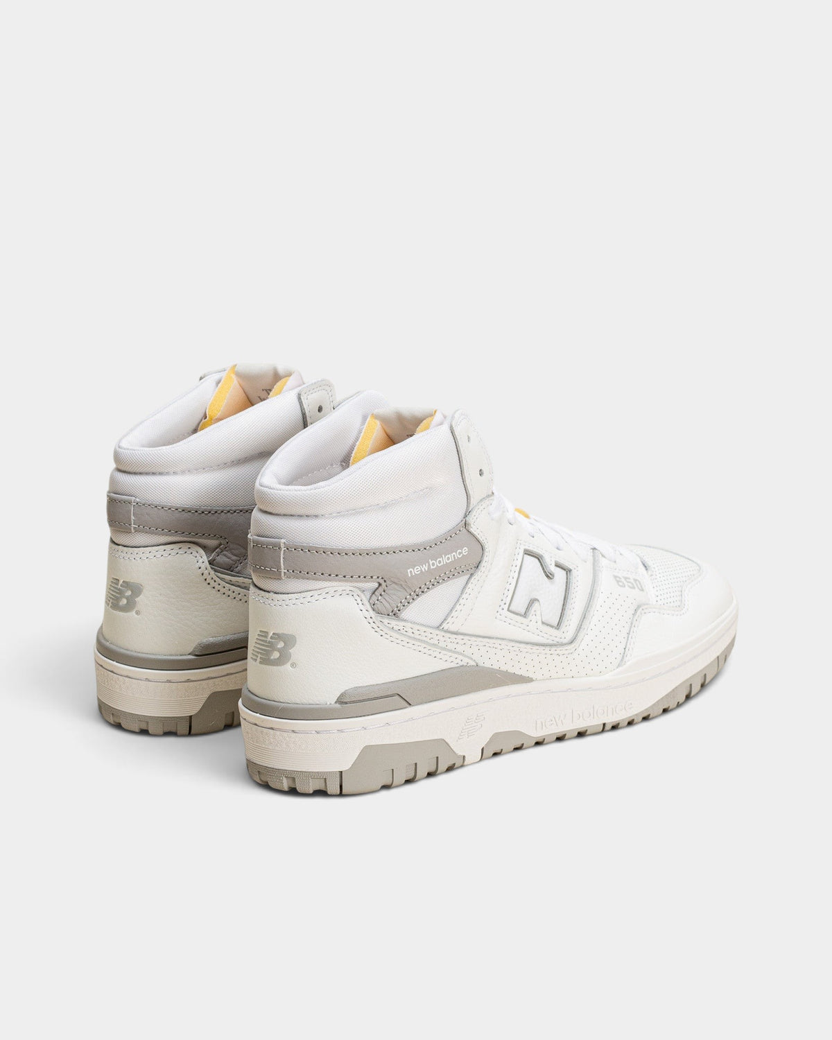 Lockwood Avenue New Balance 650R hi-top sneakers in white and raincloud gray leather with suede overlays.