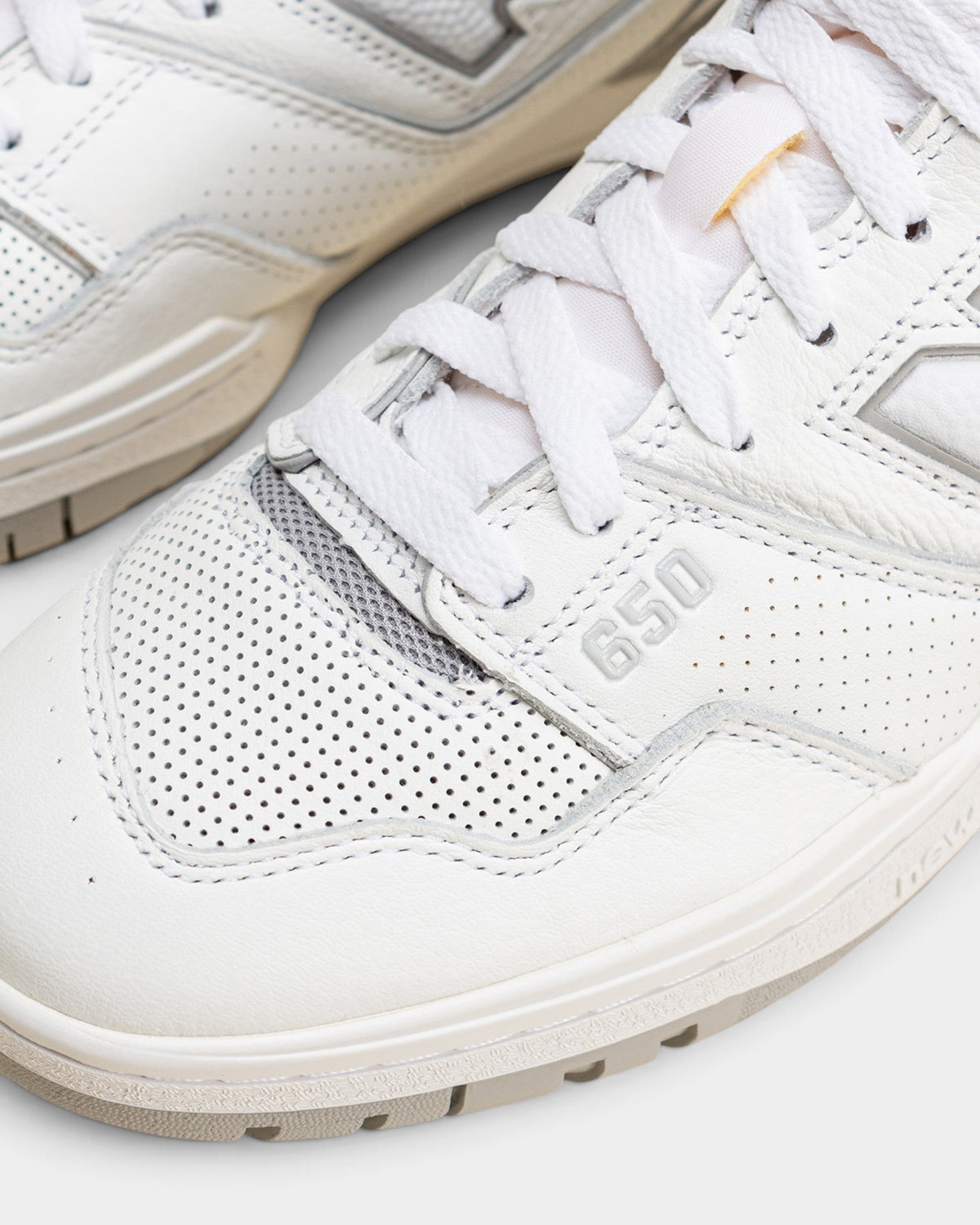 Lockwood Avenue New Balance 650R hi-top sneakers in white leather with raincloud gray suede overlays and perforated toe