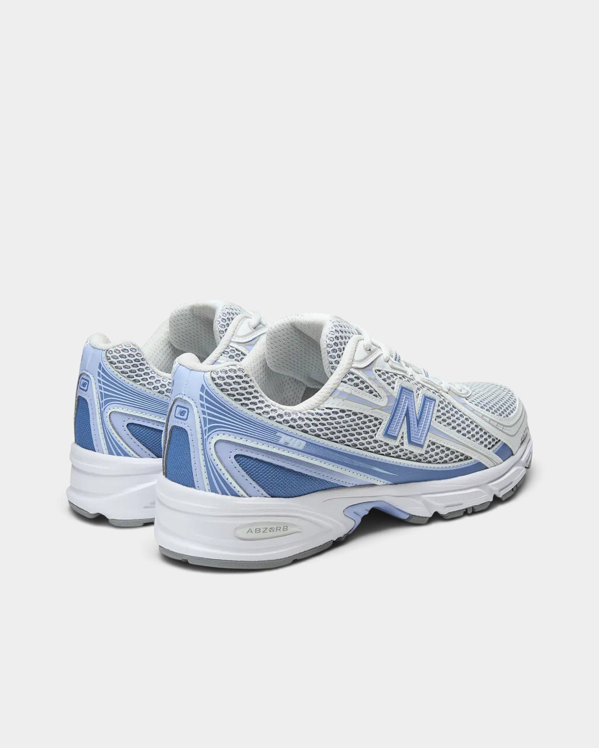 Lockwood Avenue New Balance 740 sneakers in Fairweather Blue and white with mesh upper and ABZORB midsole, rear view.