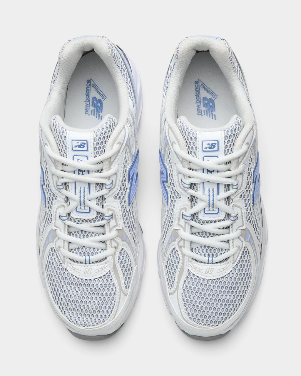 Lockwood Avenue New Balance 740 sneakers in Fairweather Blue and white with open-knit mesh and synthetic overlays.