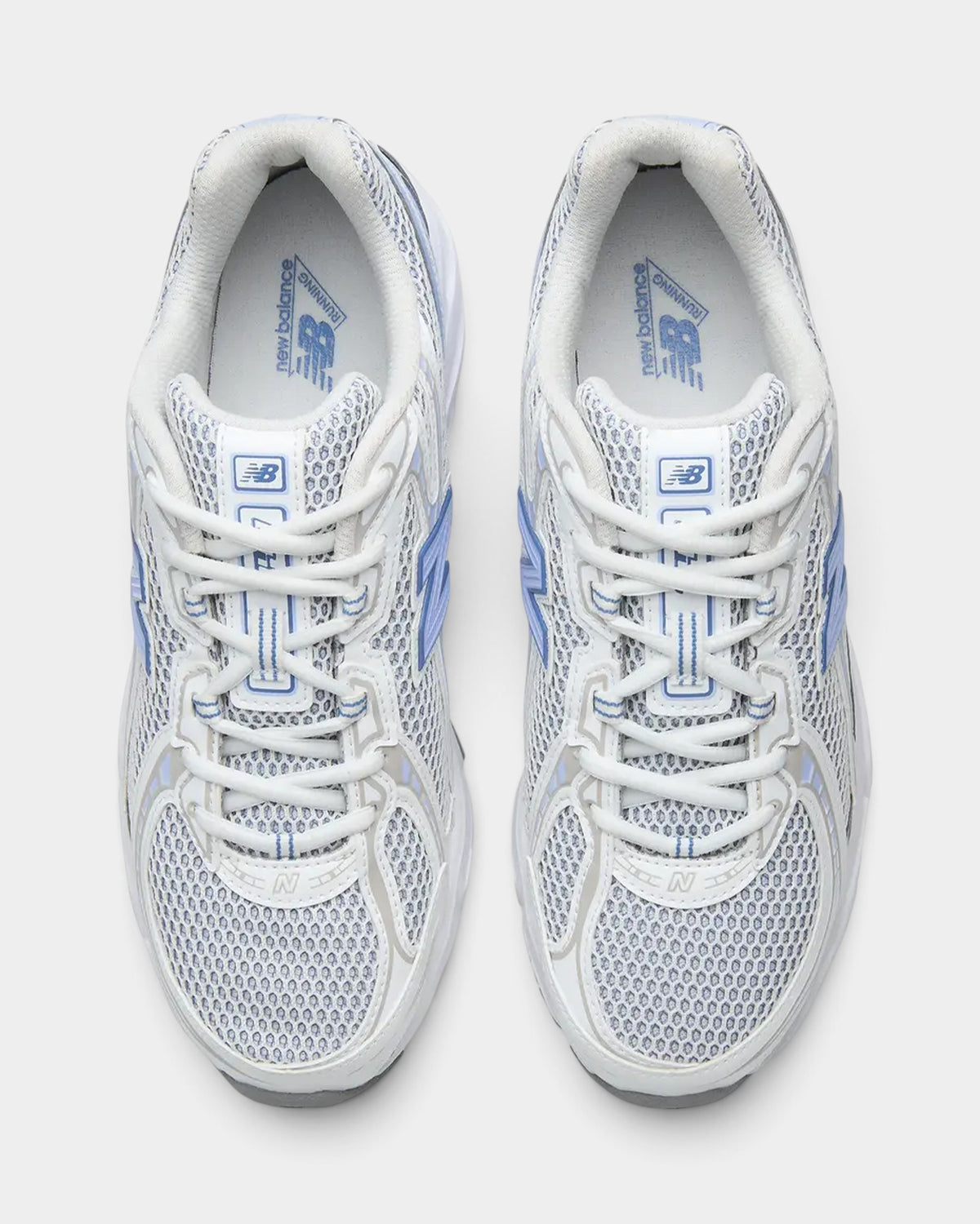 Lockwood Avenue New Balance 740 sneakers in Fairweather Blue and white with open-knit mesh and synthetic overlays.