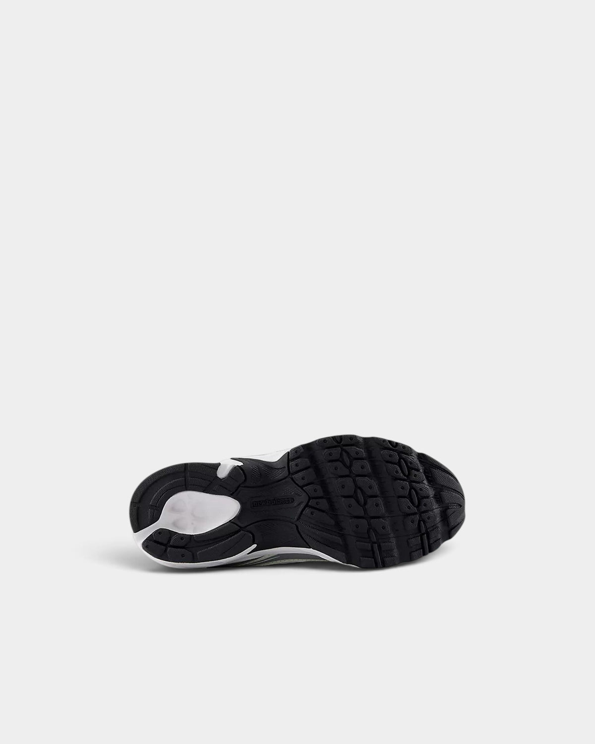 Lockwood Avenue New Balance 740 kids shoes showing the black and white rubber outsole tread pattern