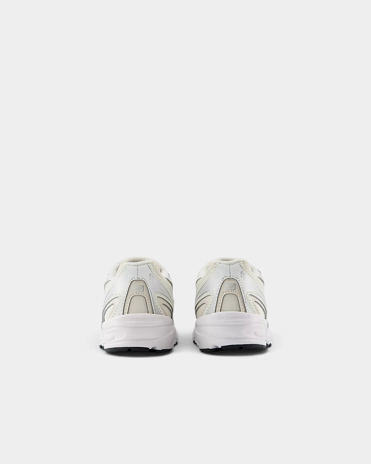 Lockwood Avenue New Balance 740 kids running shoes in off-white mesh with angular overlays, rear view