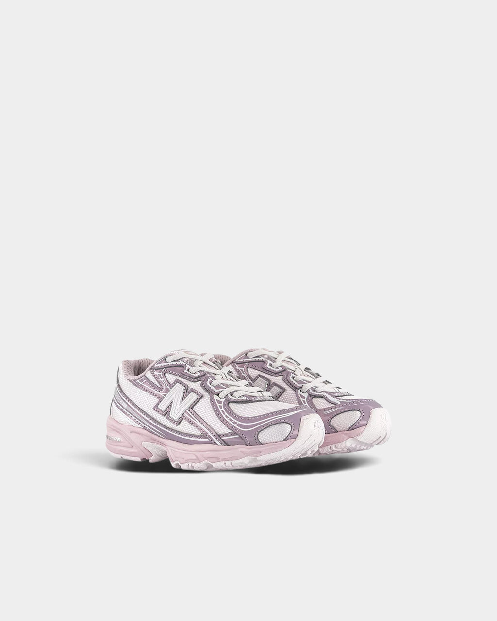 Lockwood Avenue New Balance 740 kids sneakers in light purple and white mesh with synthetic overlays and bungee laces.