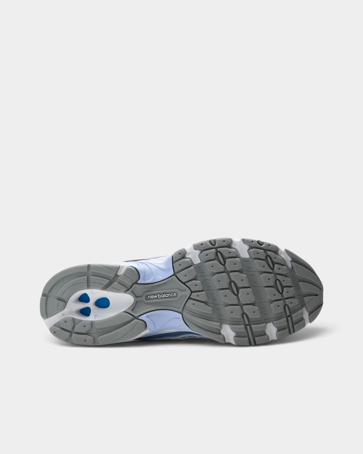 Lockwood Avenue New Balance 740 sneaker showing the grey and white rubber outsole with blue accents