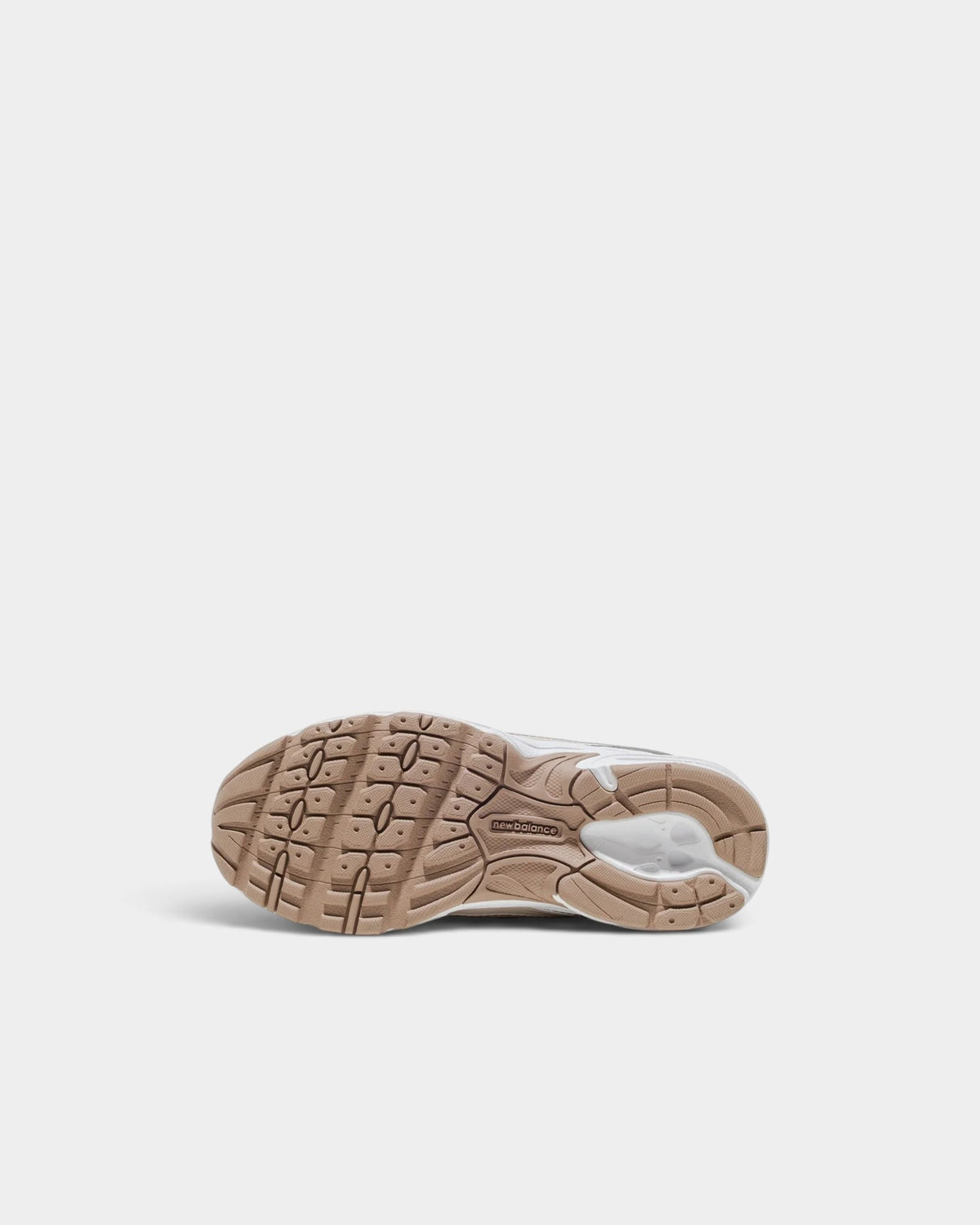 Lockwood Avenue New Balance 740 kids shoe showing the tan and white rubber tread pattern on the outsole