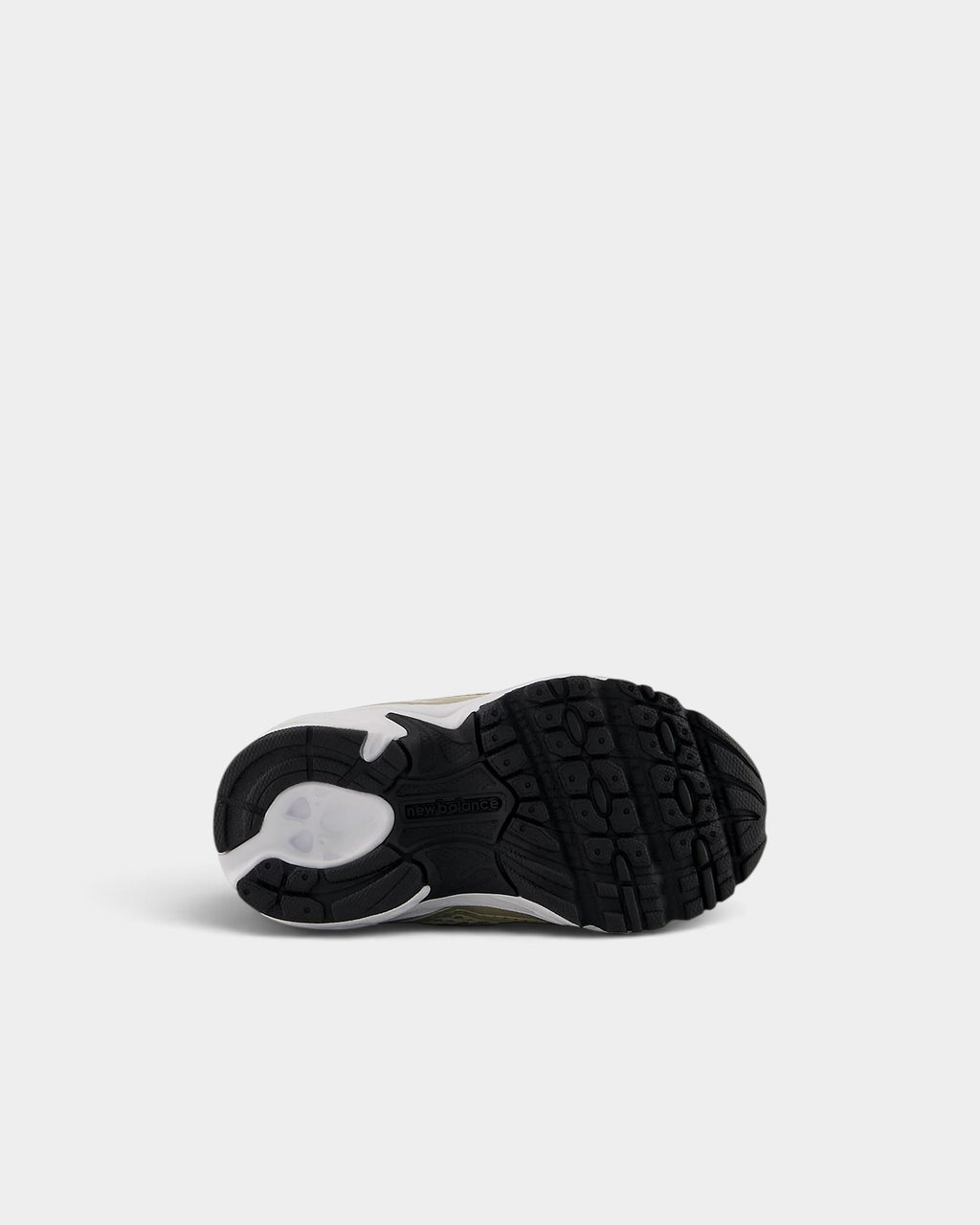 Lockwood Avenue New Balance 740 toddler shoe showing the black rubber outsole with grip pattern and white midsole