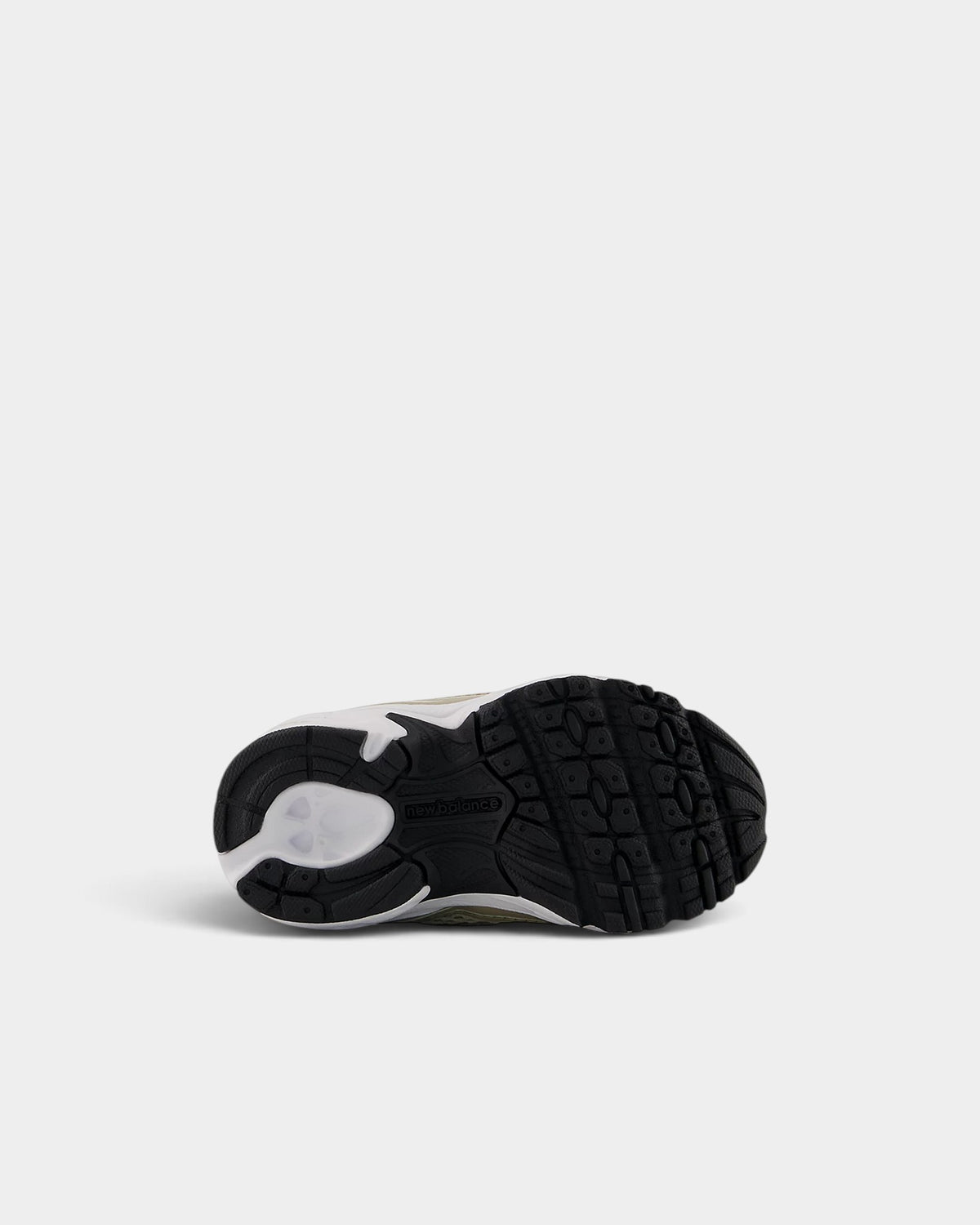 Lockwood Avenue New Balance 740 toddler shoe showing the black rubber outsole with grip pattern and white midsole
