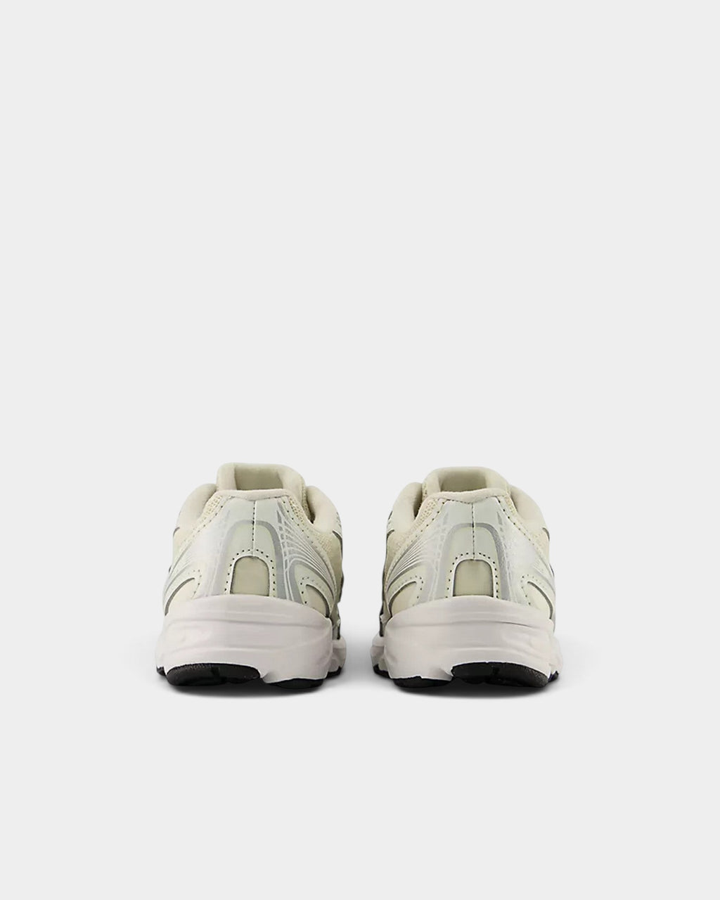 Lockwood Avenue New Balance 740 toddler shoes in off-white mesh with angular overlays, rear view.
