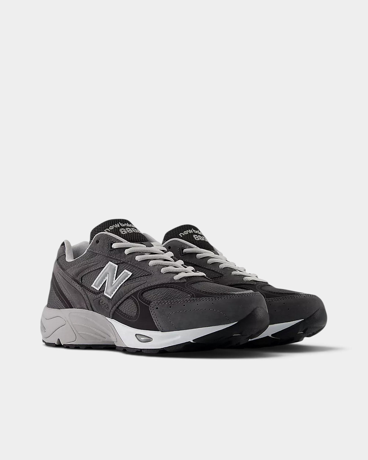 Lockwood Avenue New Balance 880 sneakers in dark grey mesh and suede with reflective details and ABZORB cushioning.