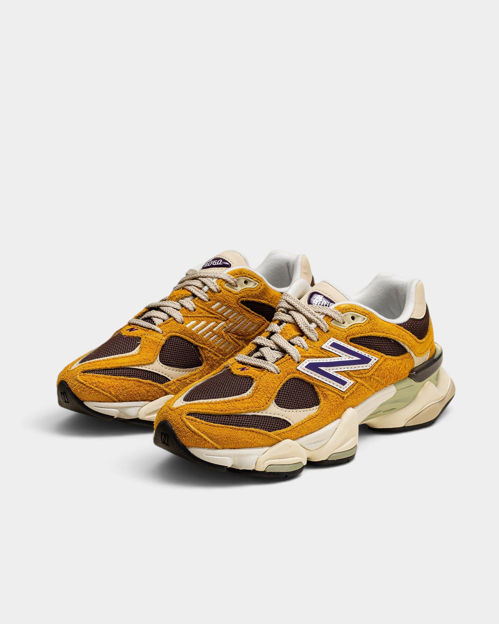 Lockwood Avenue New Balance 9060 sneakers in butterscotch shaggy suede with mesh panels and chunky sculpted midsole.