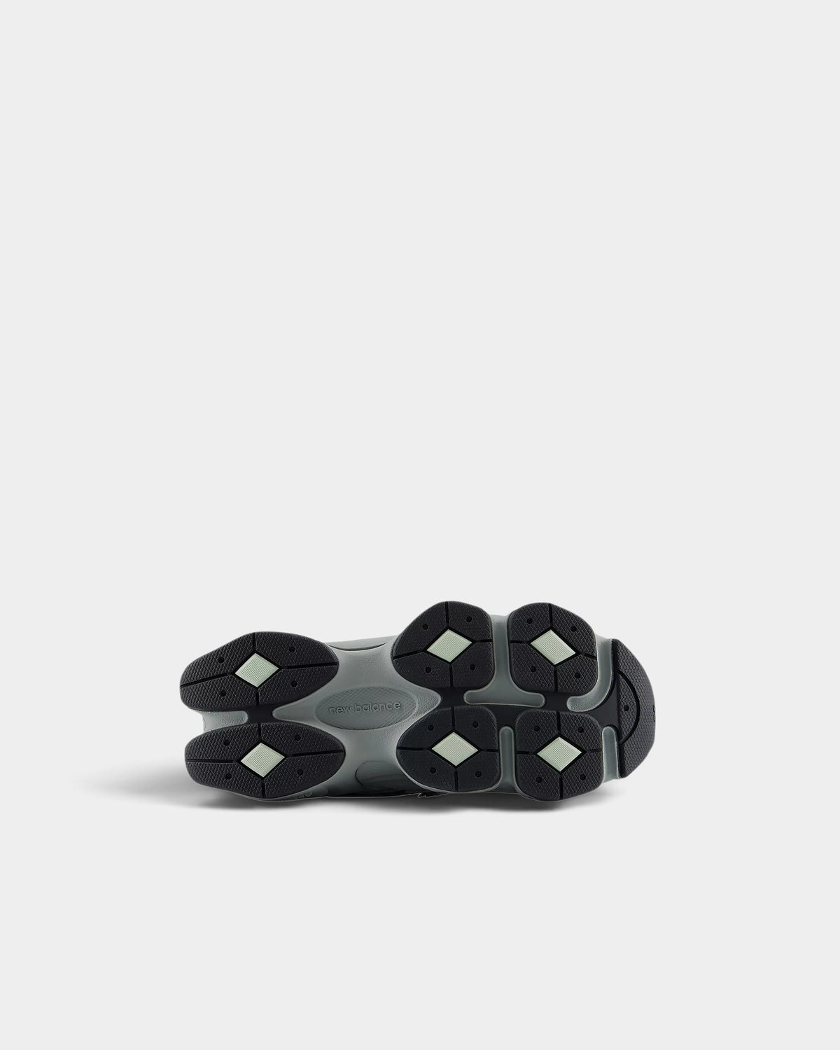 Lockwood Avenue New Balance 9060 kids shoes showing the grey diamond-patterned rubber outsole with ABZORB cushioning.