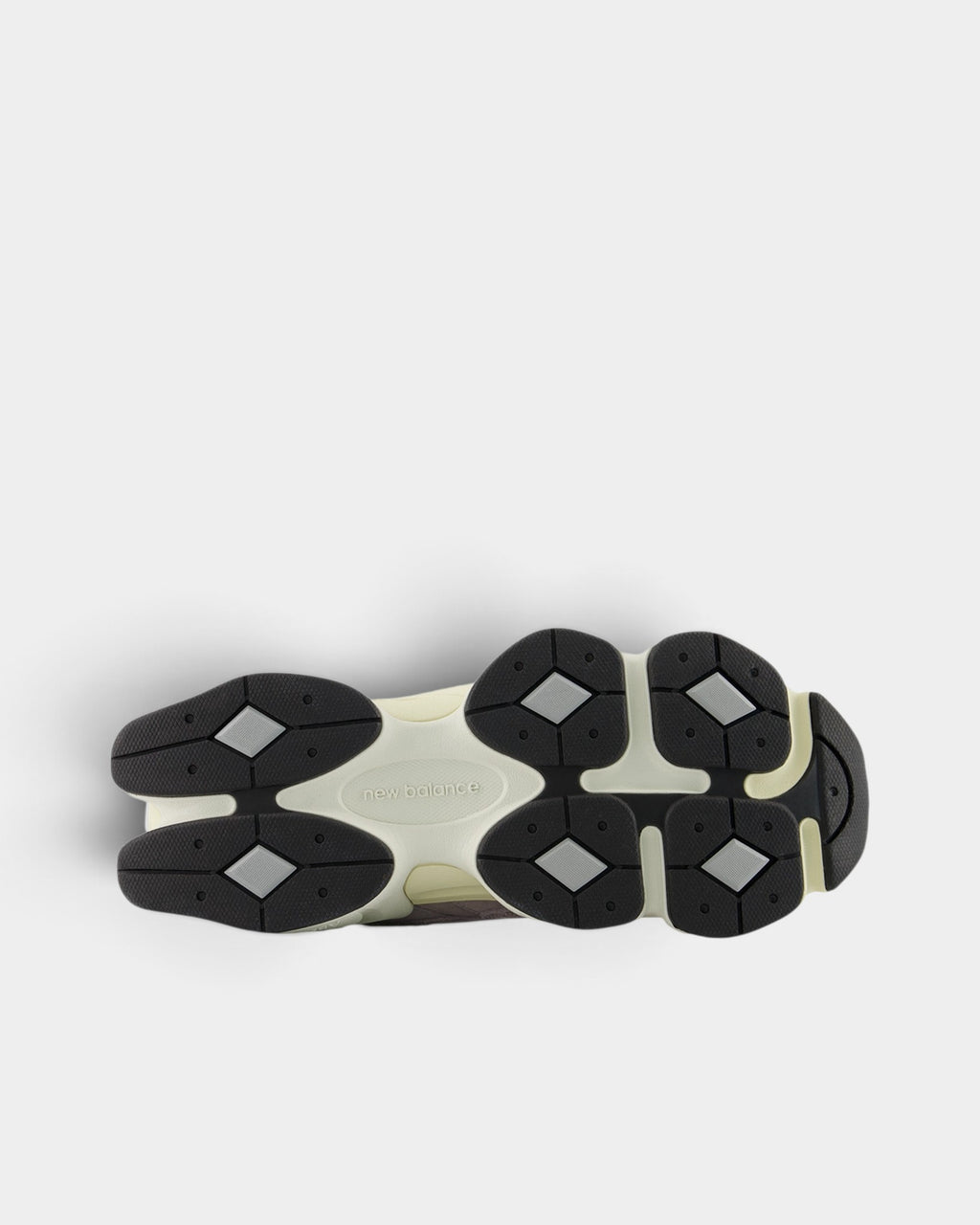 Lockwood Avenue New Balance 9060 sneaker showing the detailed black and cream sculpted rubber outsole