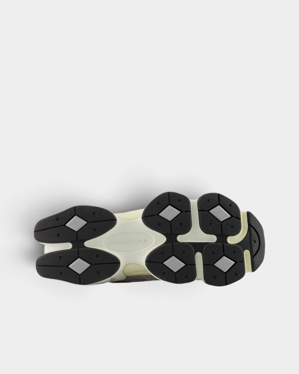 Lockwood Avenue New Balance 9060 sneaker showing the detailed black and cream sculpted rubber outsole