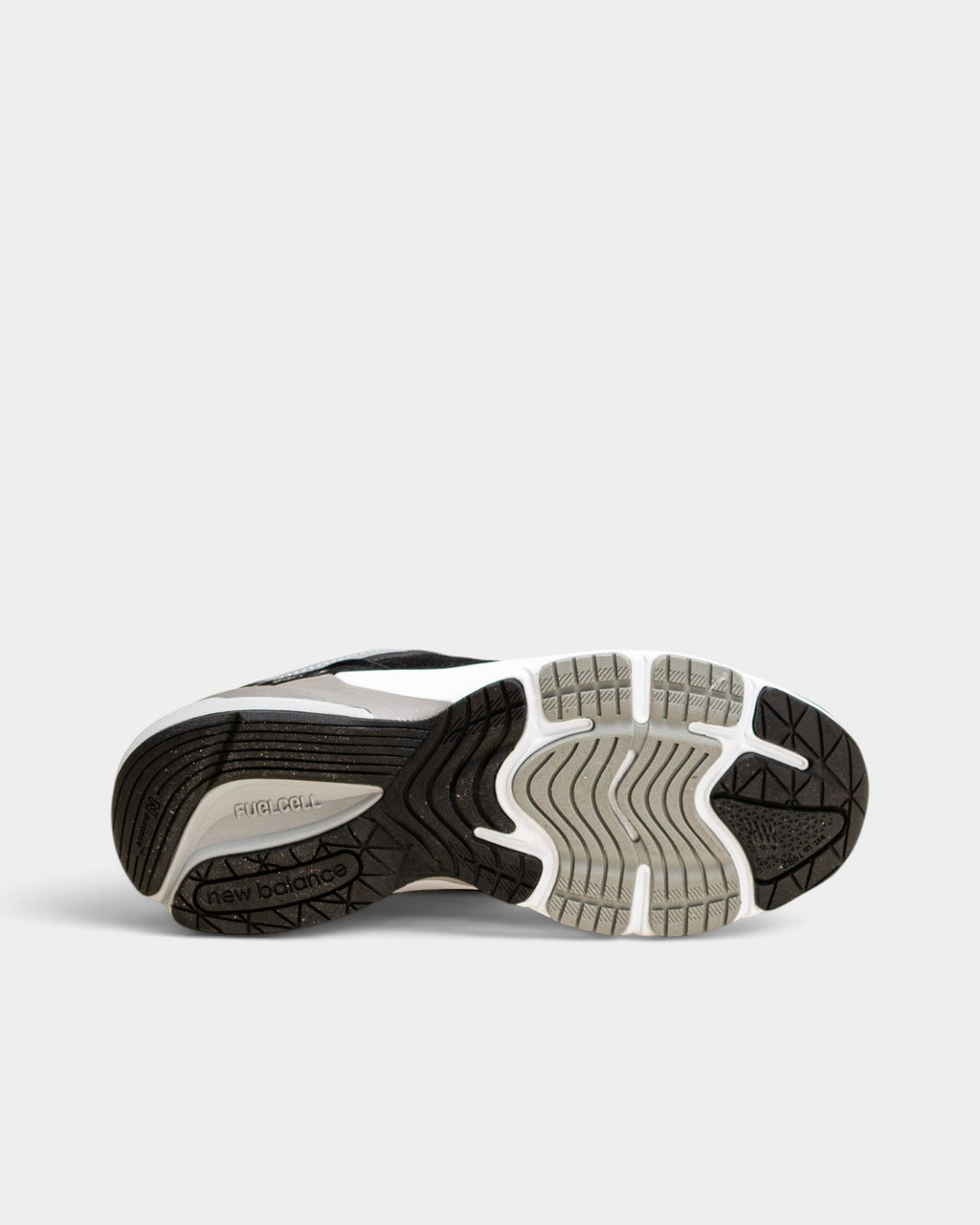 Lockwood Avenue New Balance 990v6 women's sneaker showing the black and grey FuelCell rubber outsole tread pattern