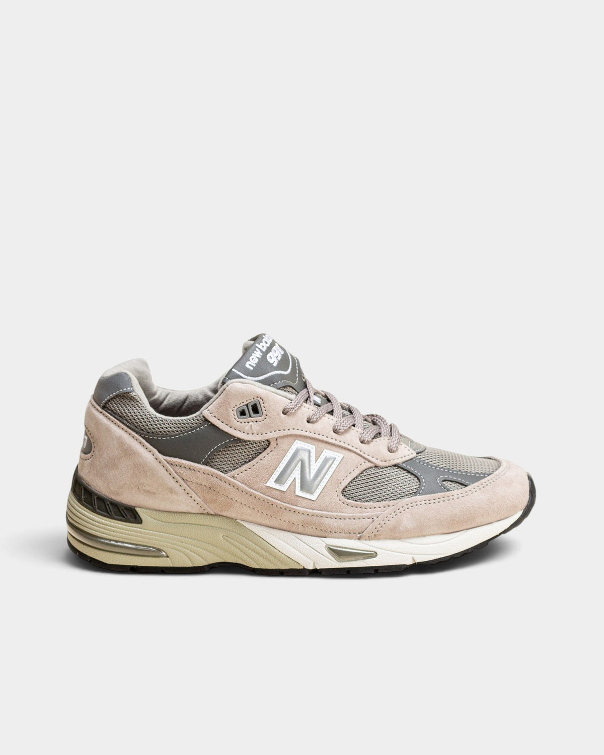 Lockwood Avenue New Balance 991 women's sneakers in gray nubuck, mesh, and suede with silver accents and ABZORB midsole.