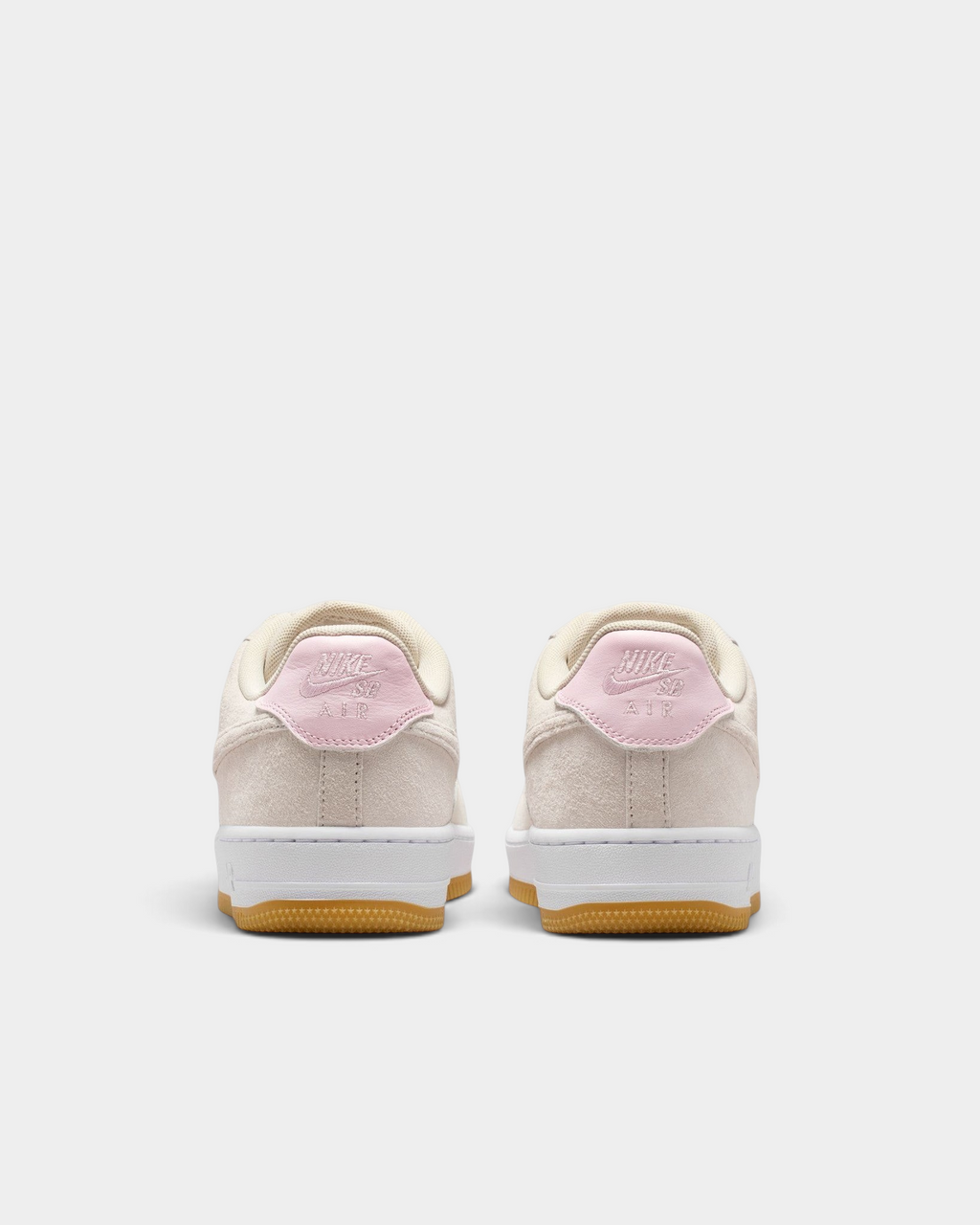 Lockwood Avenue Nike SB Air Force 1 low-top skate shoes in light orewood brown suede with pink foam heel accents.