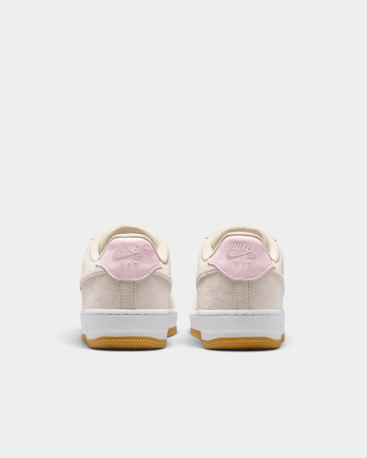 Lockwood Avenue Nike SB Air Force 1 low-top skate shoes in light orewood brown suede with pink foam heel accents.