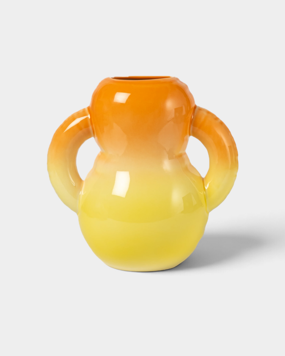 Lockwood Avenue Home Studyo OSCAR ceramic vase with a hand-sprayed orange to yellow ombre finish and dual handles.