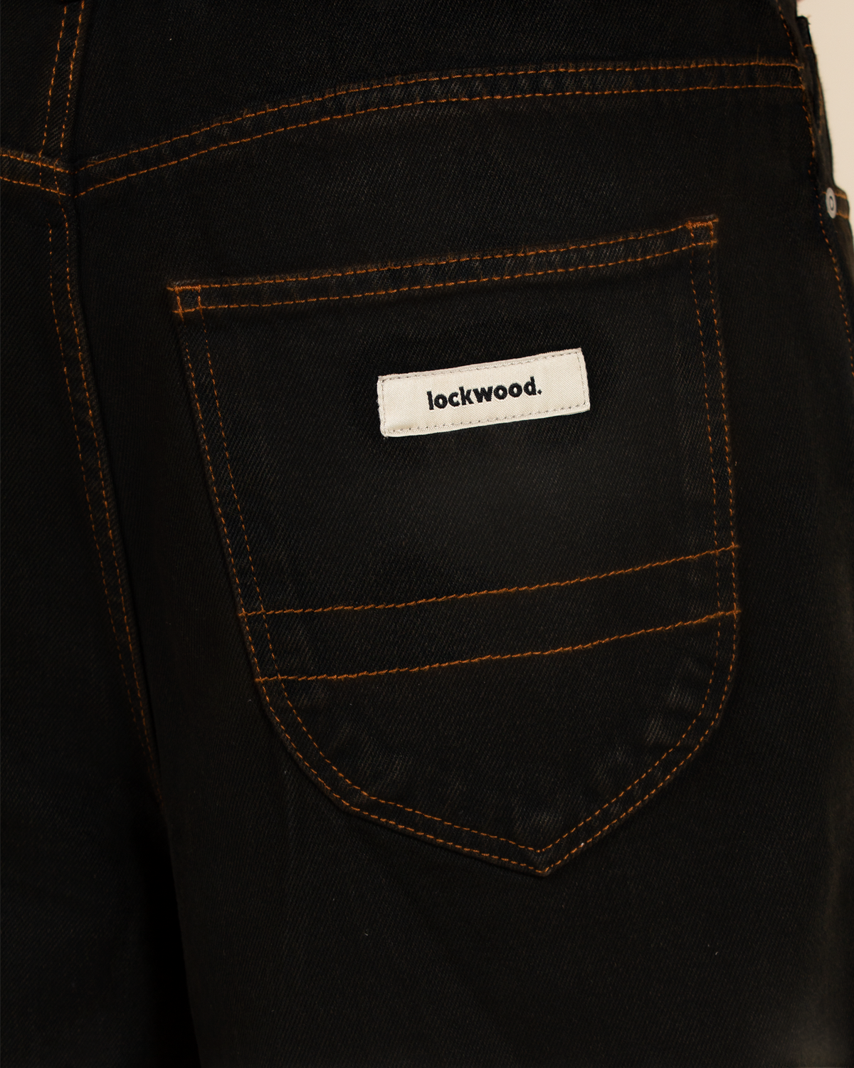 Lockwood Avenue baggy jeans shorts in white with black overdye effect and branded back pocket label