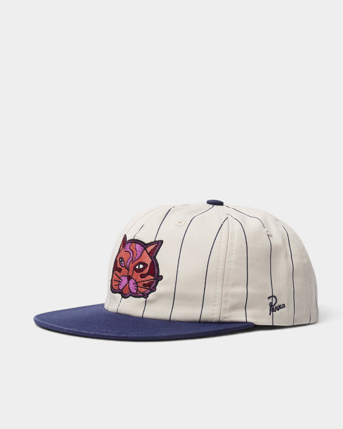 Lockwood Avenue by Parra Earl Face 6-panel hat in cream pinstriped twill with a navy brim and embroidered cat graphic.