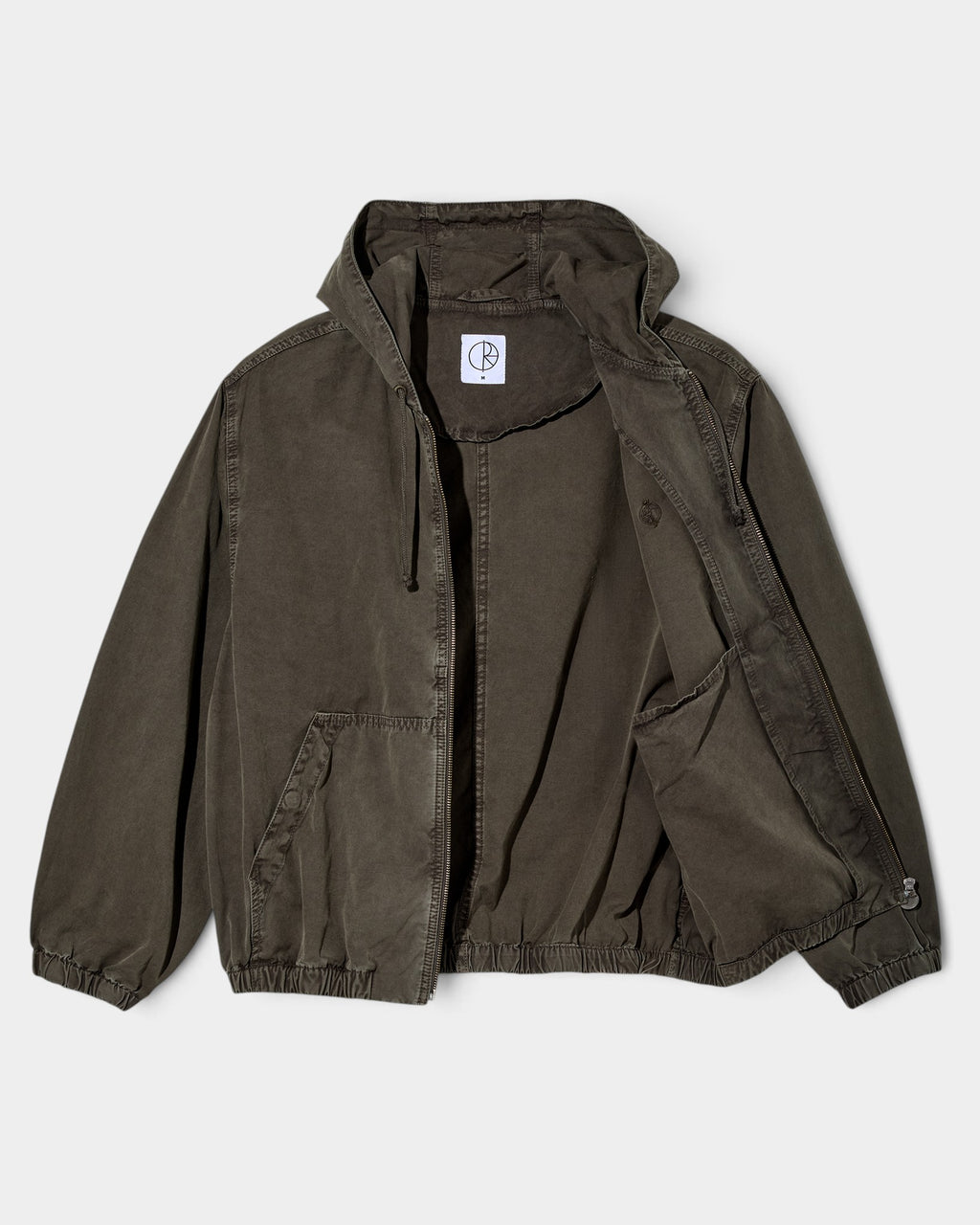 Lockwood Avenue Polar Hooded Nick Jacket in dark olive garment-dyed cotton canvas with a wide fit and front pockets.