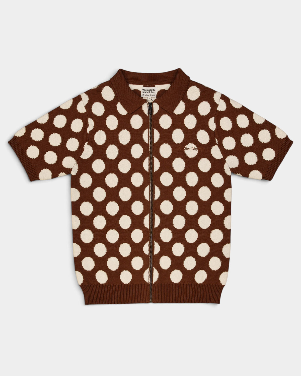 Lockwood Avenue The Loose Company brown and cream polka dot knit zip-up polo shirt with ribbed trim.
