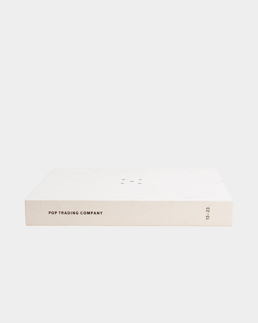 Lockwood Avenue Pop Trading Company 2013-2023 linen hardcover book with minimalist branding on the spine