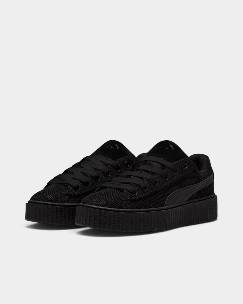 Lockwood Avenue Puma Creeper Phatty all-black corduroy platform sneakers with suede tongue and gold lace tips.