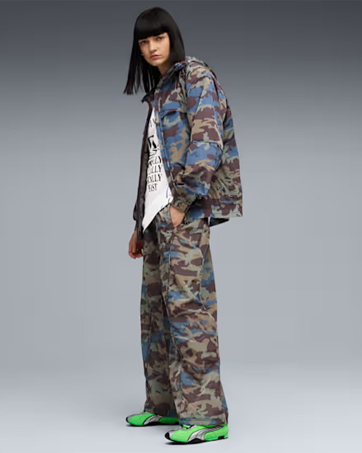 Lockwood Avenue model wearing camo jacket and pants with bright green Puma H-Street OG running shoes