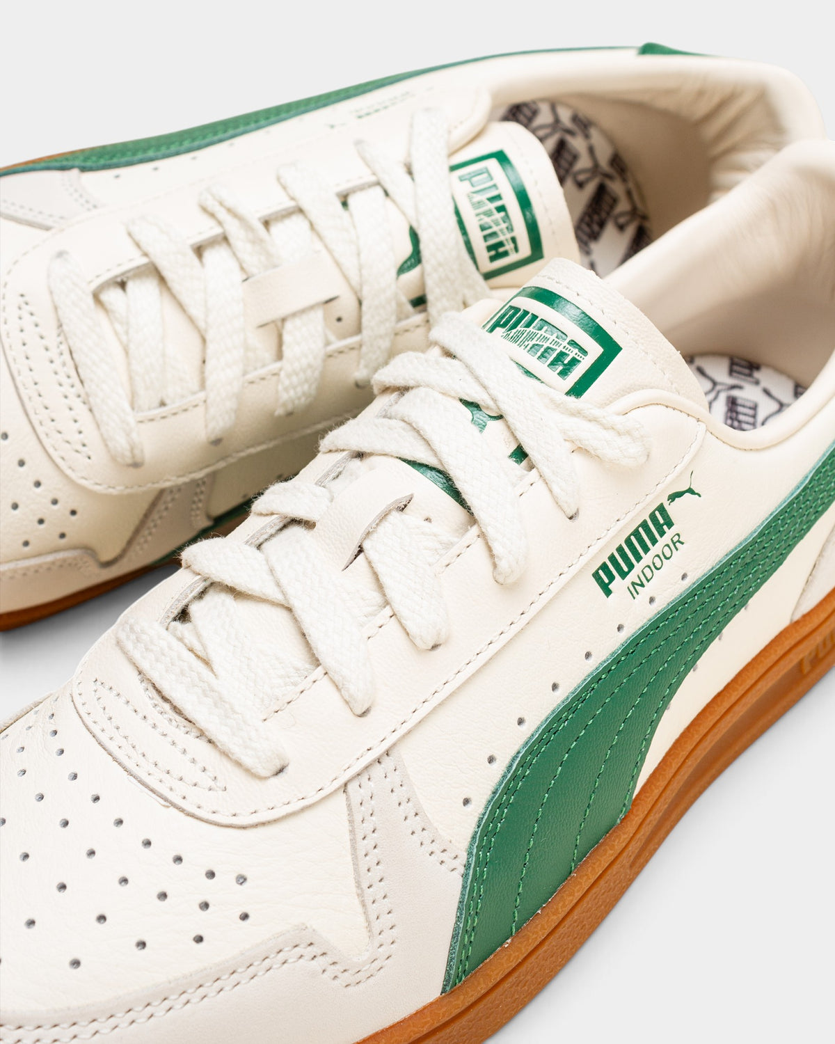 Lockwood Avenue Puma Indoor OG sneakers in frosted ivory leather with vine green accents and a gum rubber outsole.