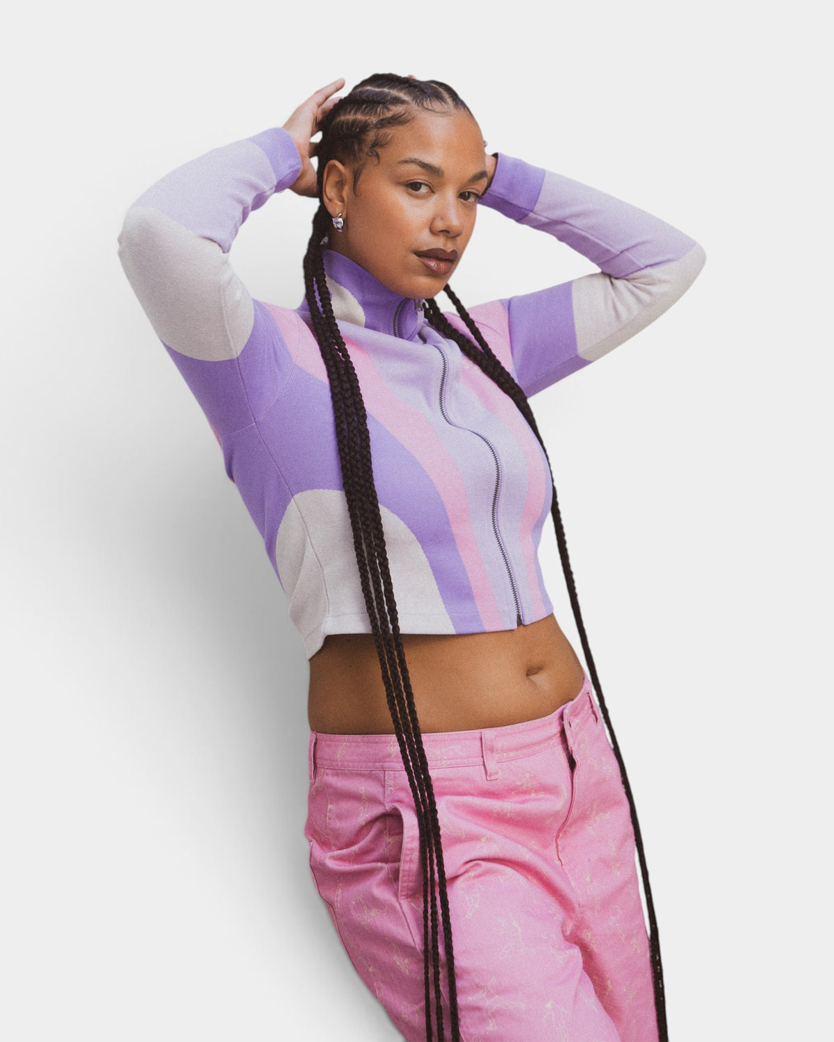 Lockwood Avenue Puma x KidSuper purple and lavender jacquard knit track top with full zip on a female model
