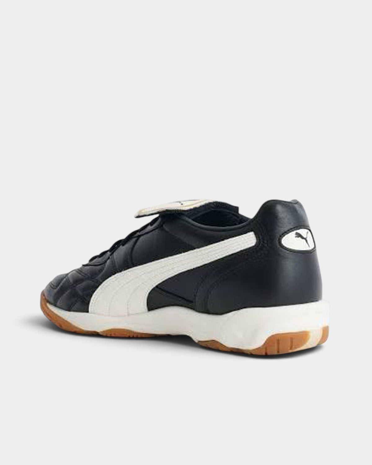 Lockwood Avenue Puma King indoor soccer shoes in black leather with a white side stripe and gum rubber sole