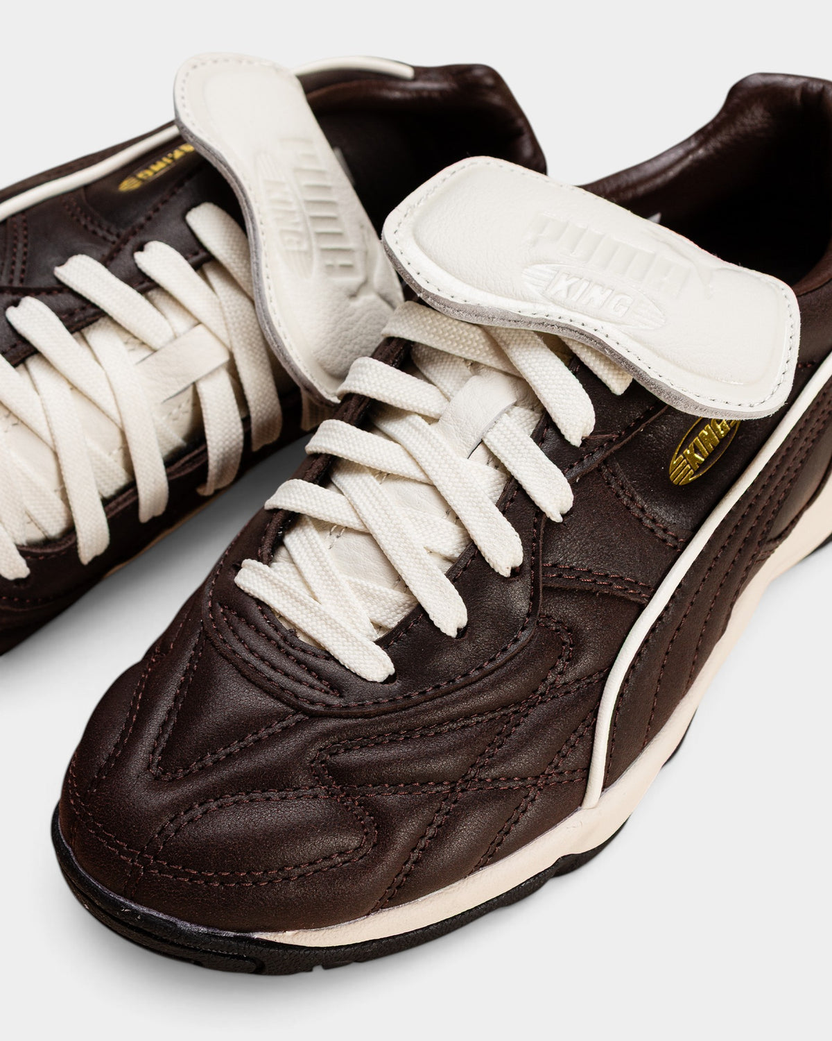 Lockwood Avenue Puma King Indoor Premium leather football shoes in dark chocolate brown with a white fold-over tongue.