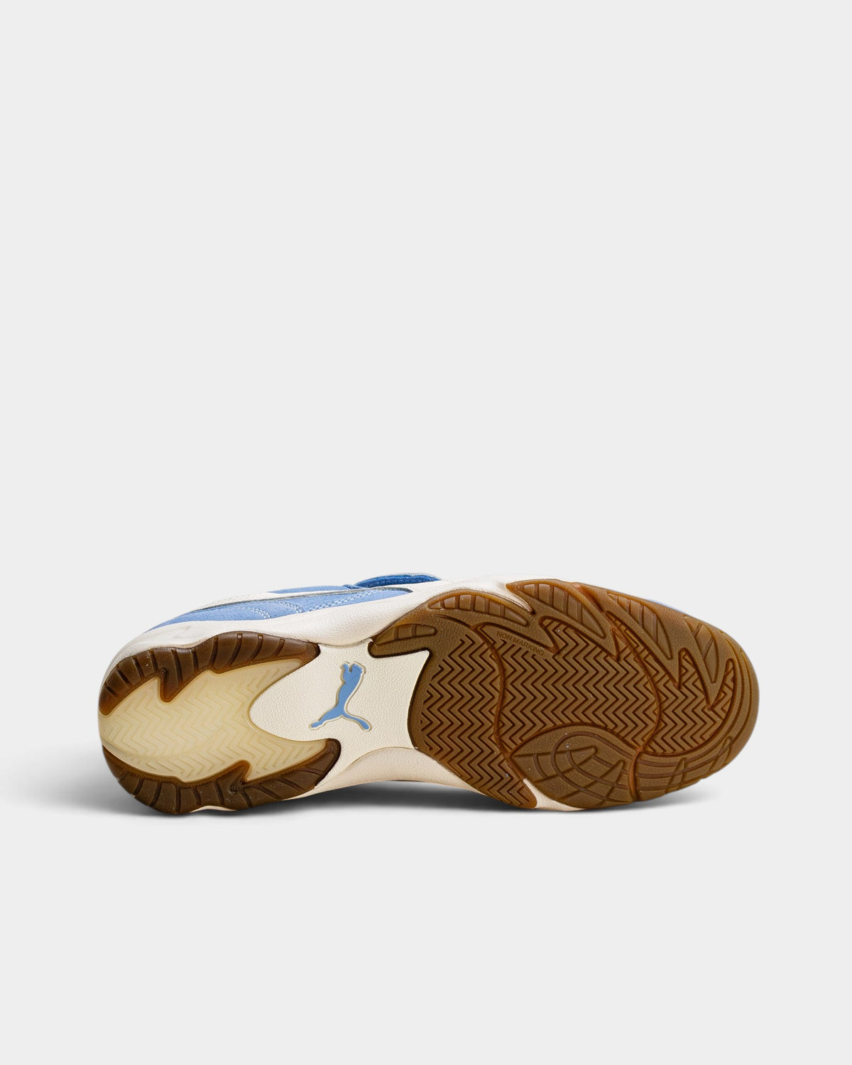 Lockwood Avenue Puma King Indoor Royalty sneakers showing the gum rubber indoor court sole and blue logo detail