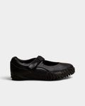 Lockwood Avenue Puma Mostro Fey LTH black leather Mary Jane shoes with a single strap and spiked rubber outsole.