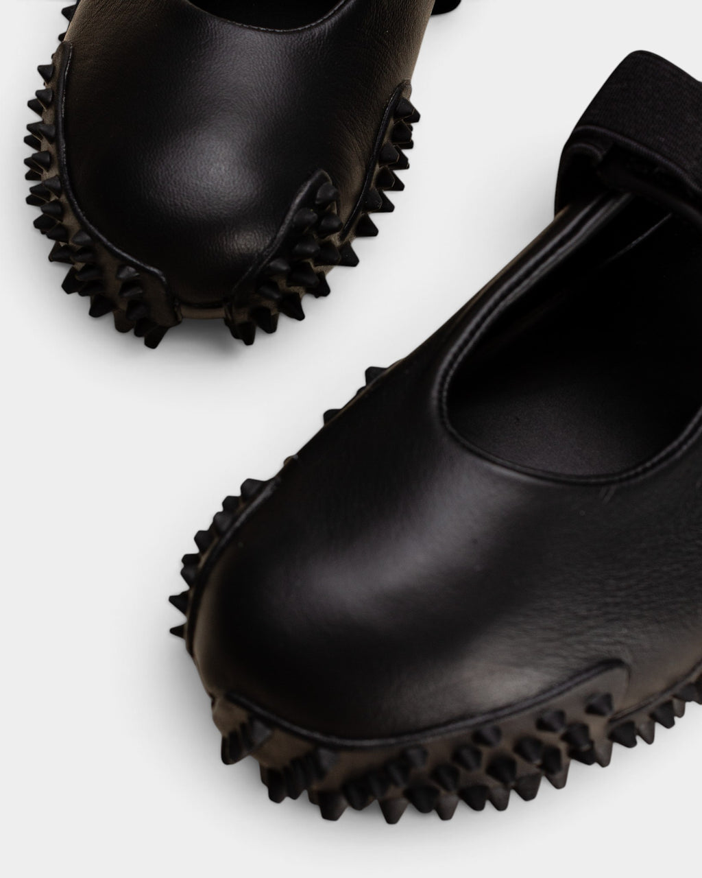 Lockwood Avenue Puma Mostro Fey LTH black leather Mary Jane shoes featuring a signature spiked rubber outsole.