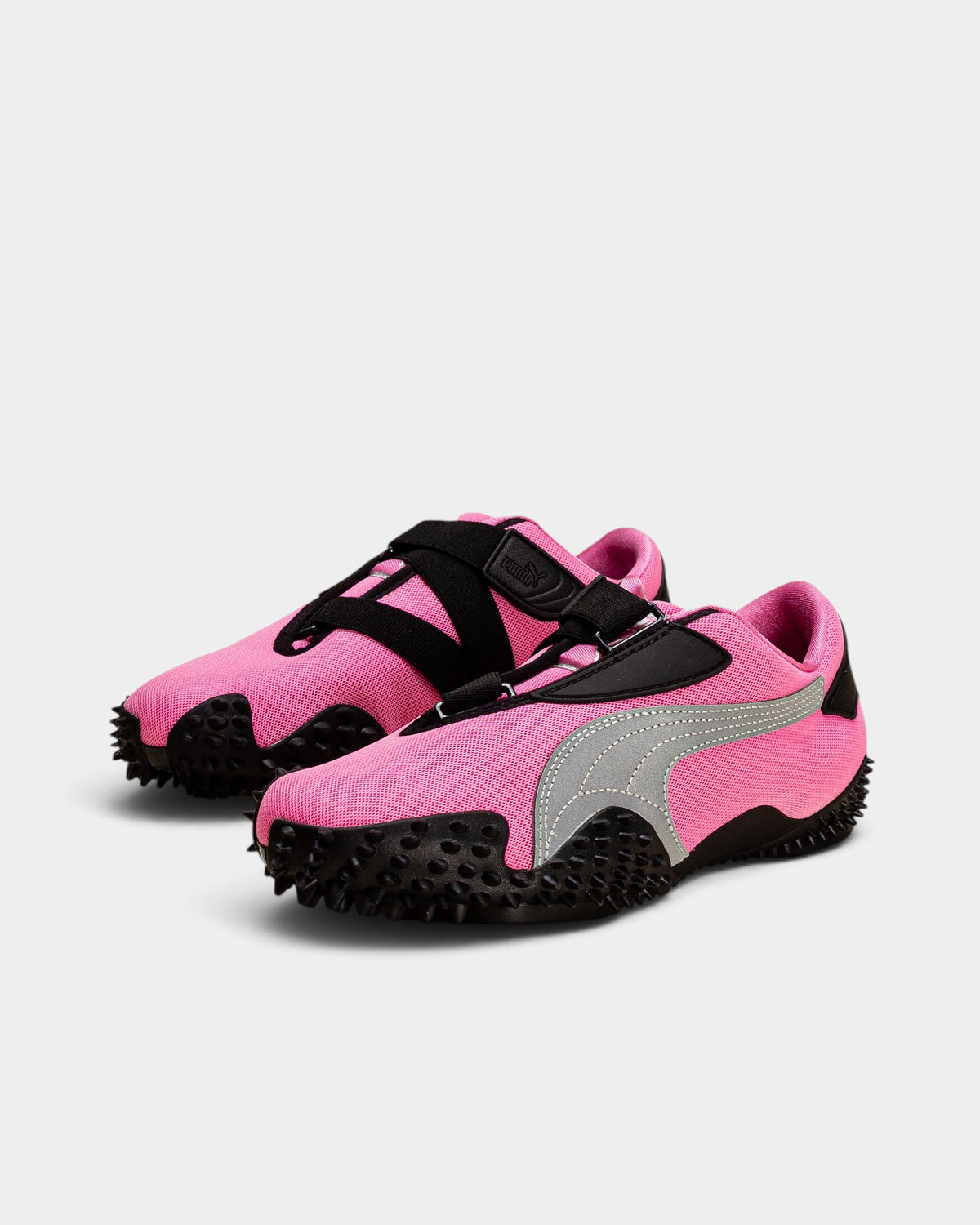 Lockwood Avenue Puma Mostro OG shoes in Posie Pink with silver accents, black hook-and-loop straps, and spiked soles.