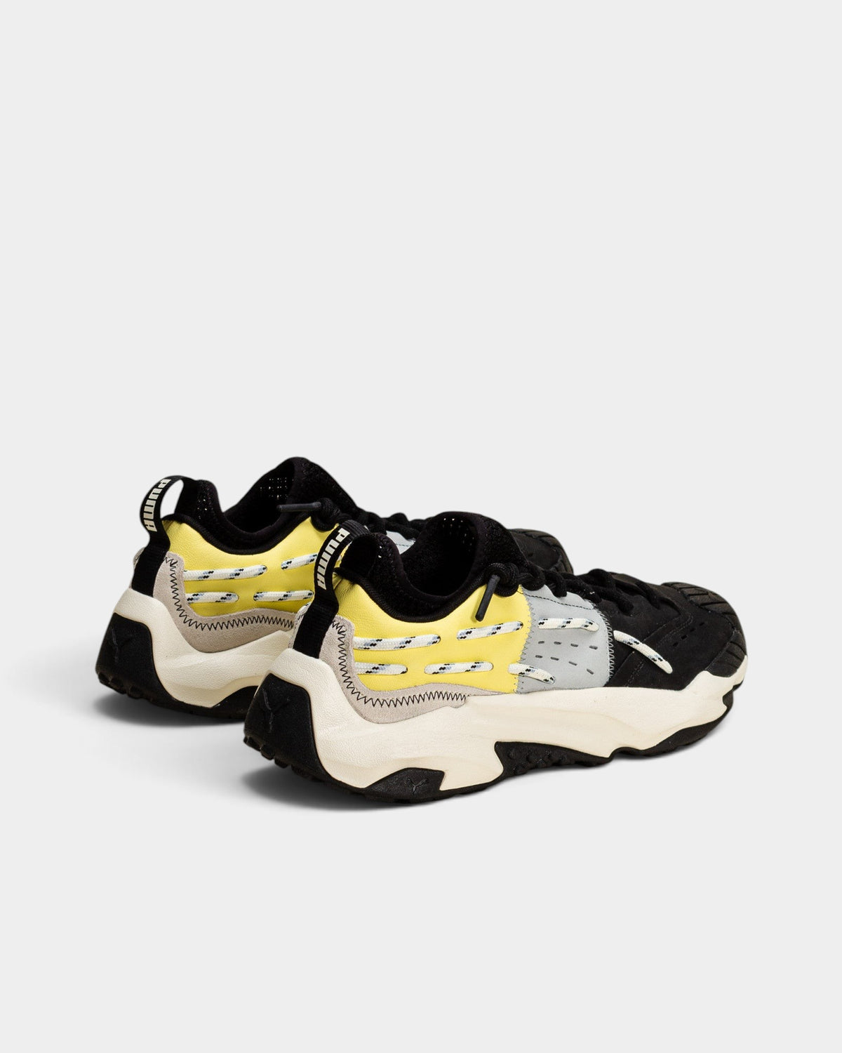 Lockwood Avenue Puma Plexus Retro chunky sneakers in black and pale lemon with layered nubuck, leather, and suede.