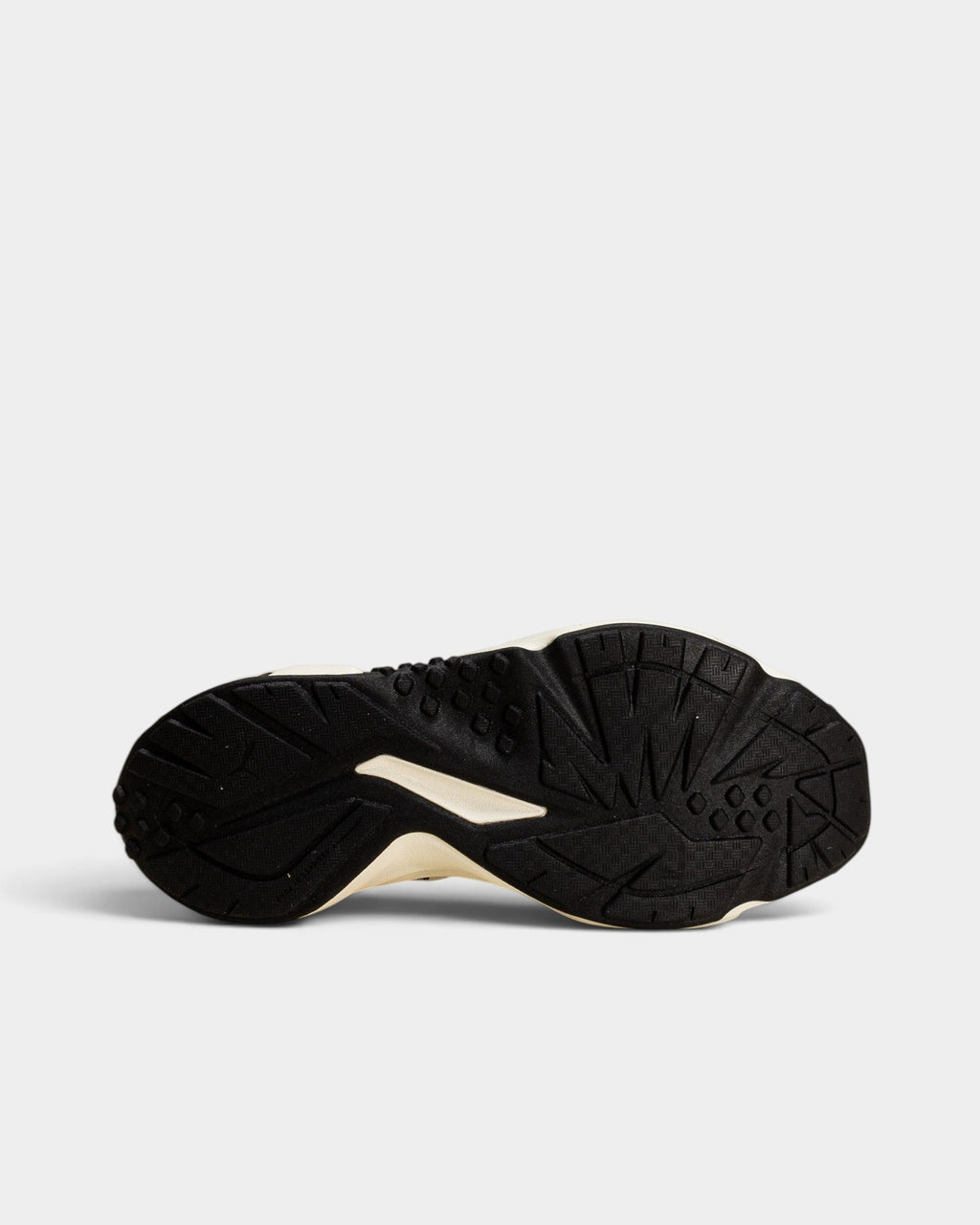 Lockwood Avenue Puma Plexus Retro shoe showing the black and pale lemon rubber outsole tread pattern