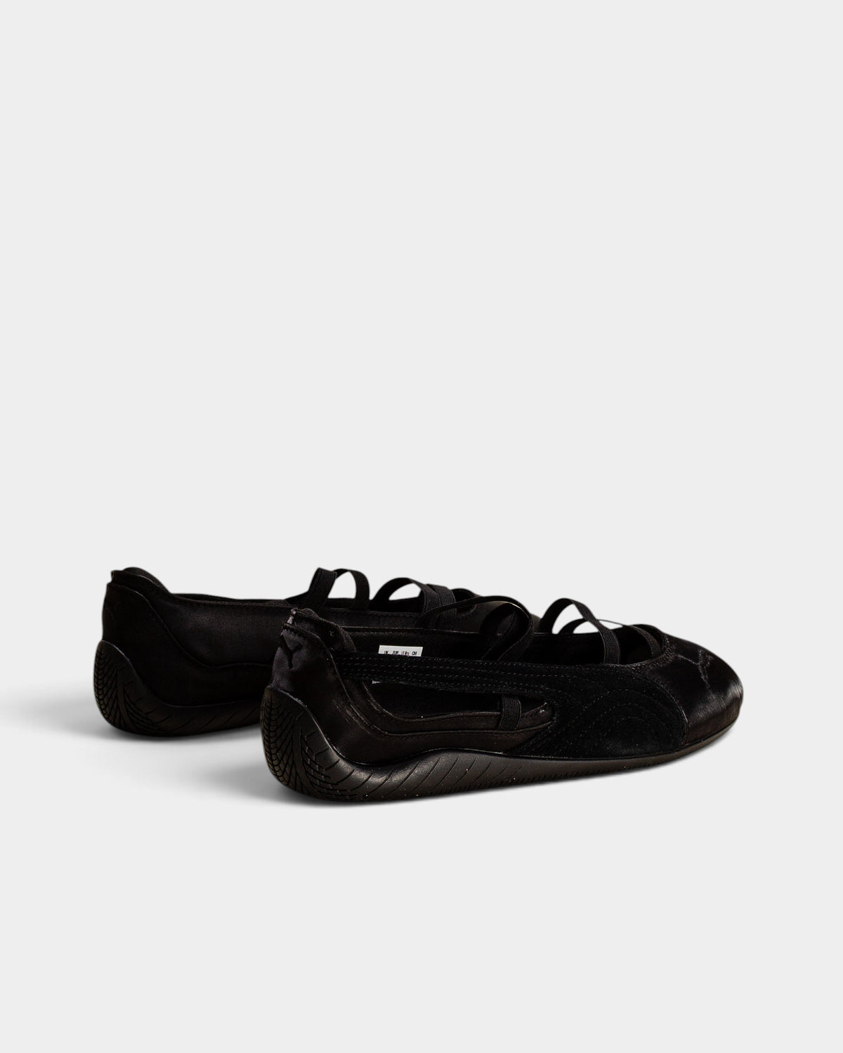 Lockwood Avenue Puma Speedcat black satin ballet flats with suede Formstrip and elastic instep straps.