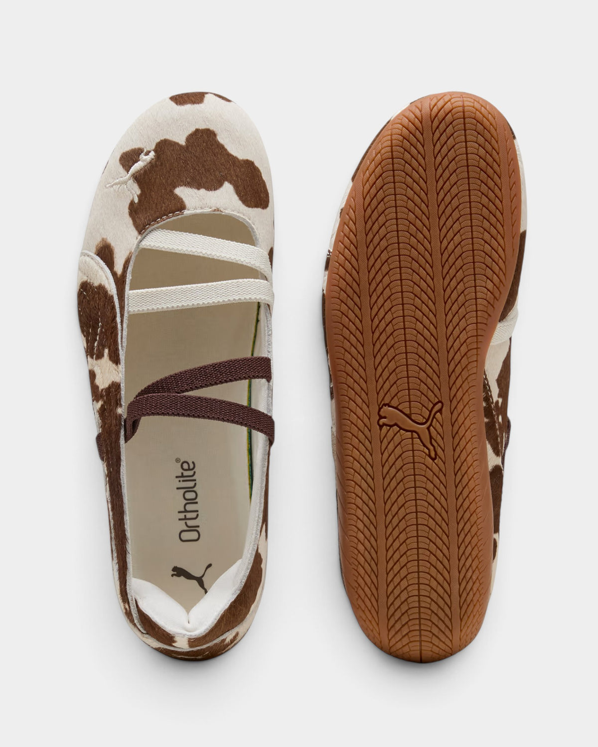 Lockwood Avenue Puma Speedcat ballet flats in brown and white cow-print pony hair with tire-tread rubber outsoles.